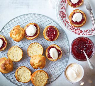A wire rack serving ice cream scones with jam